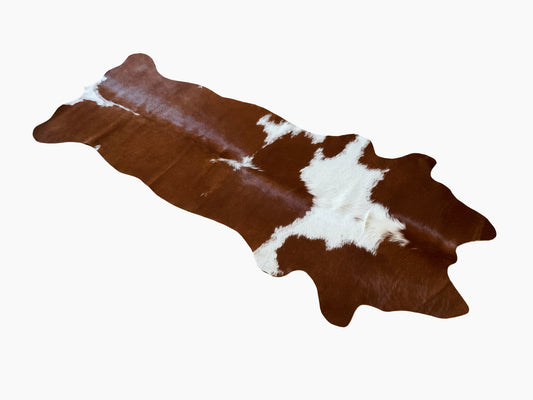 unendlich schoen - Echter Kuhfell Teppich klein, "Die rustikale Schönheit" Handmade in Germany, geruchsneutral, Rinderfell ideal für Wohnzimmer Esszimmer Flur (braun weiß, 160 x 70 cm)